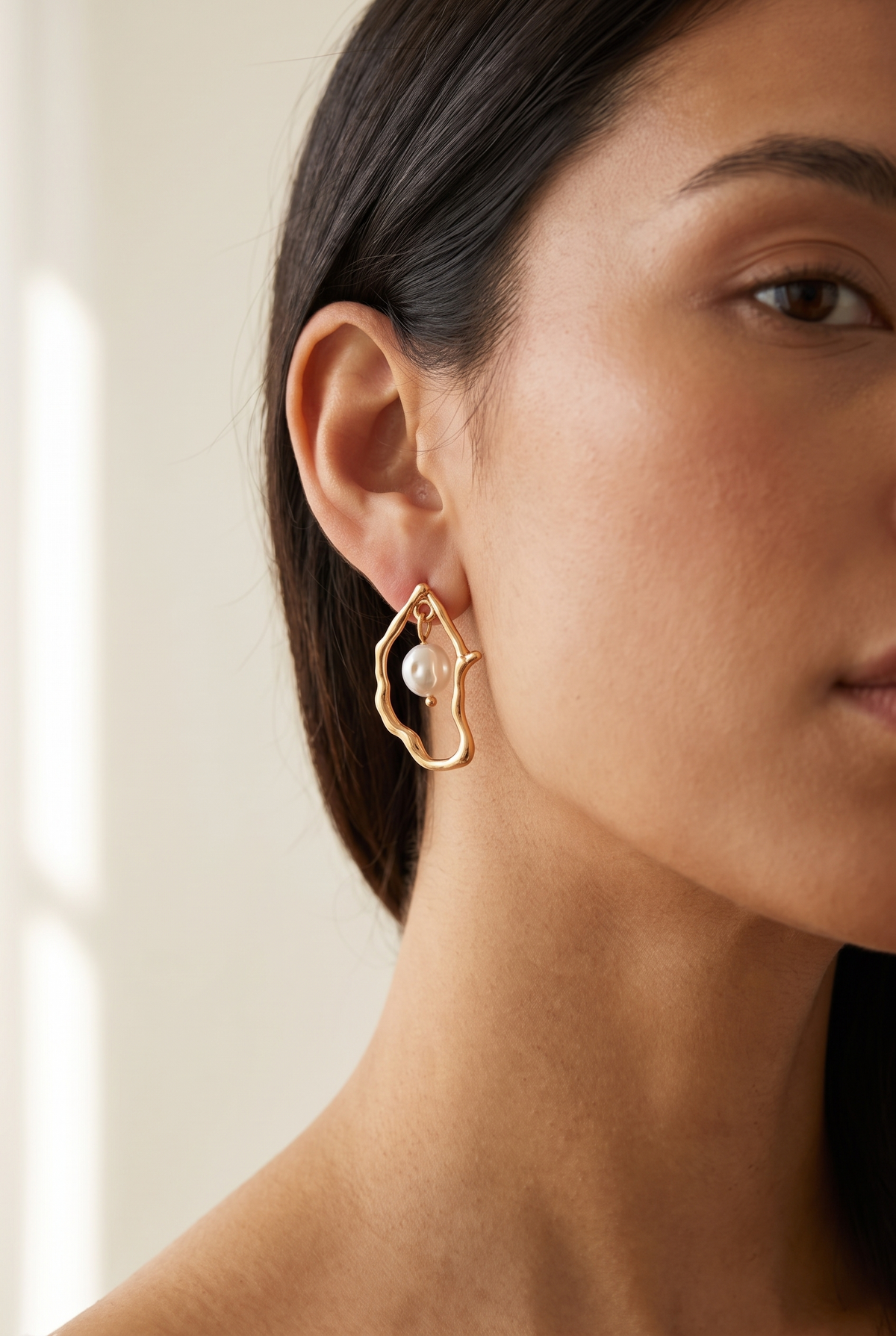 Model wearing the oyster pearl drop earring