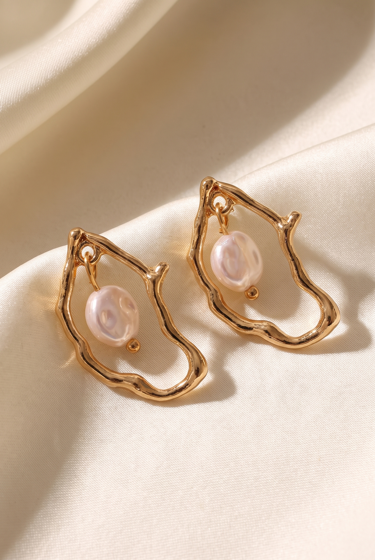 Oyster pearl irregular shaped drop earrings on ivory silk